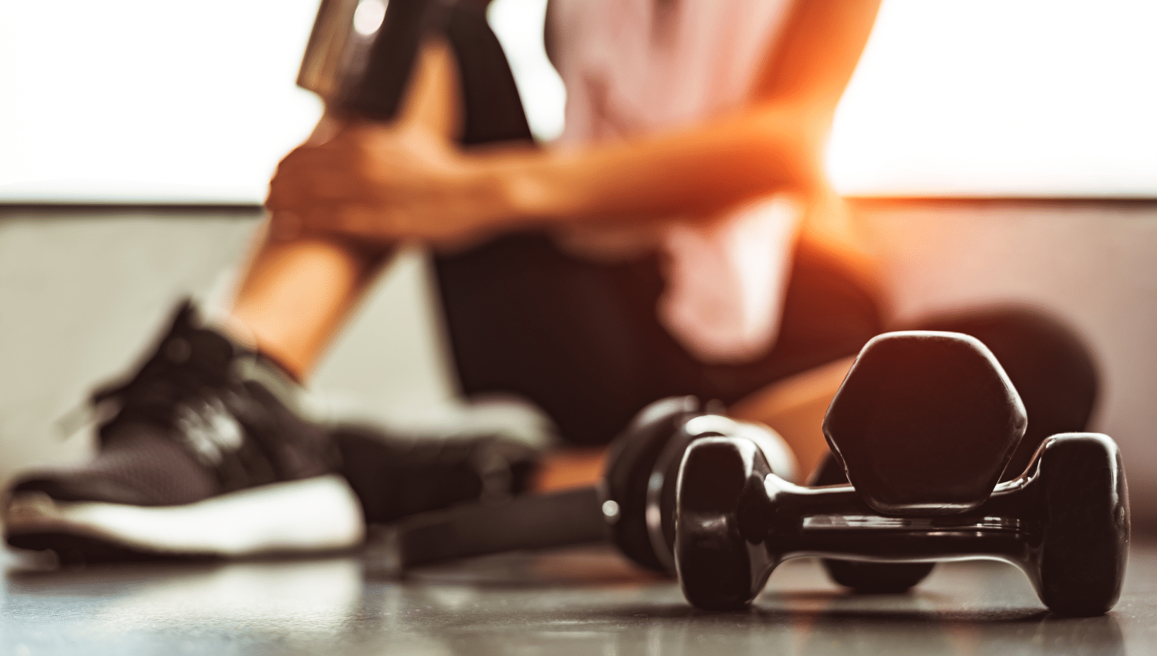 women behind dumbbell weights